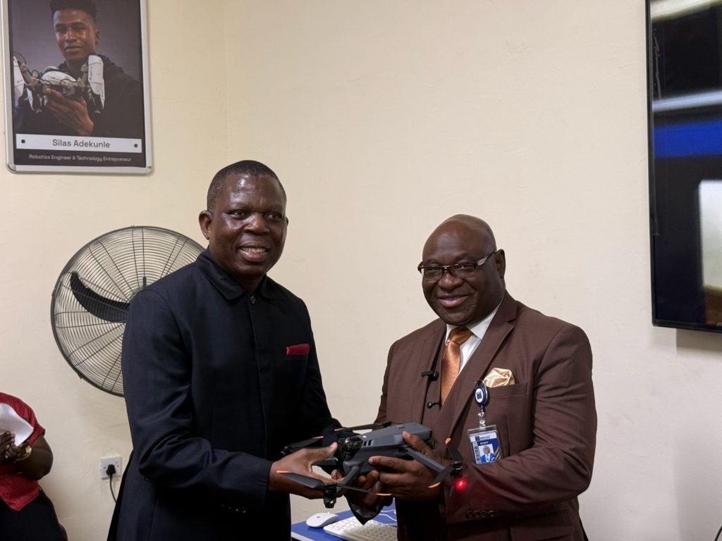 MD of New Horizons hands over drone.
